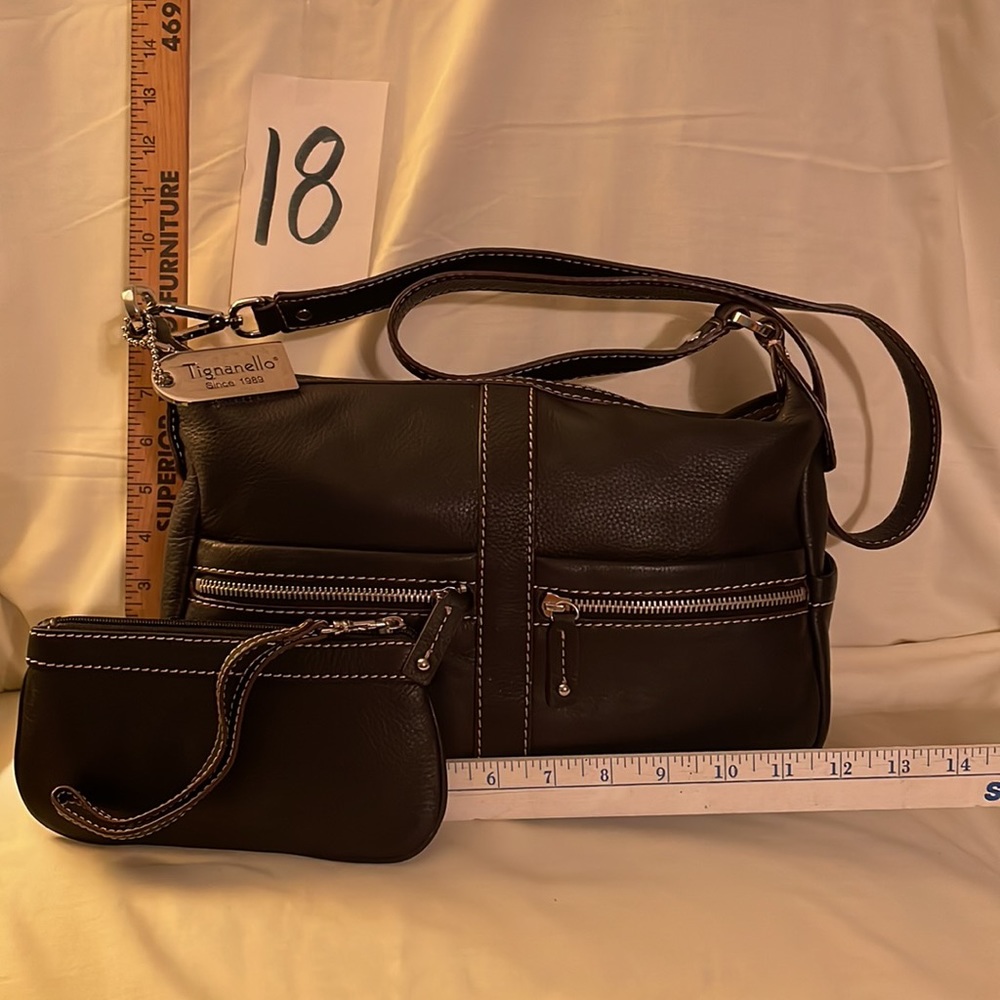 Brand new, never used, black leather Tignanello shoulder bag with wristlet.